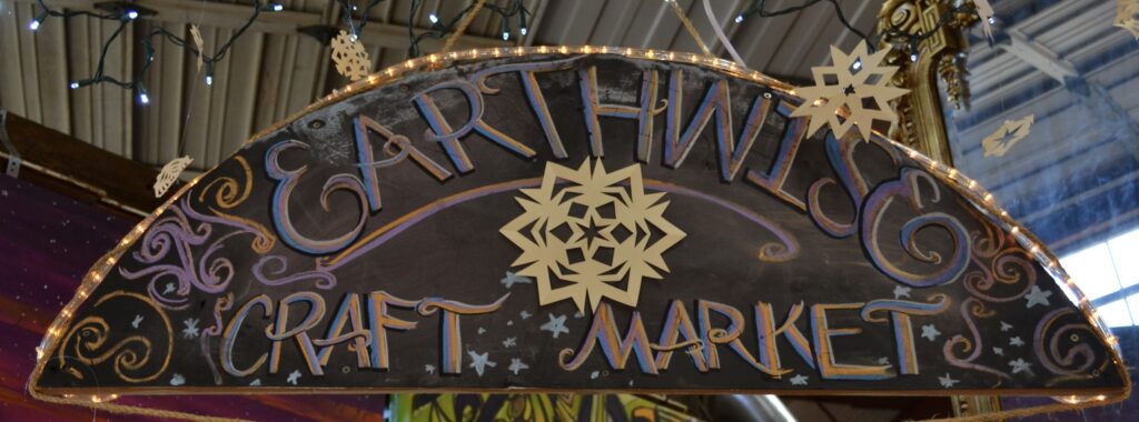 the sign for the Earthwise Craft Market