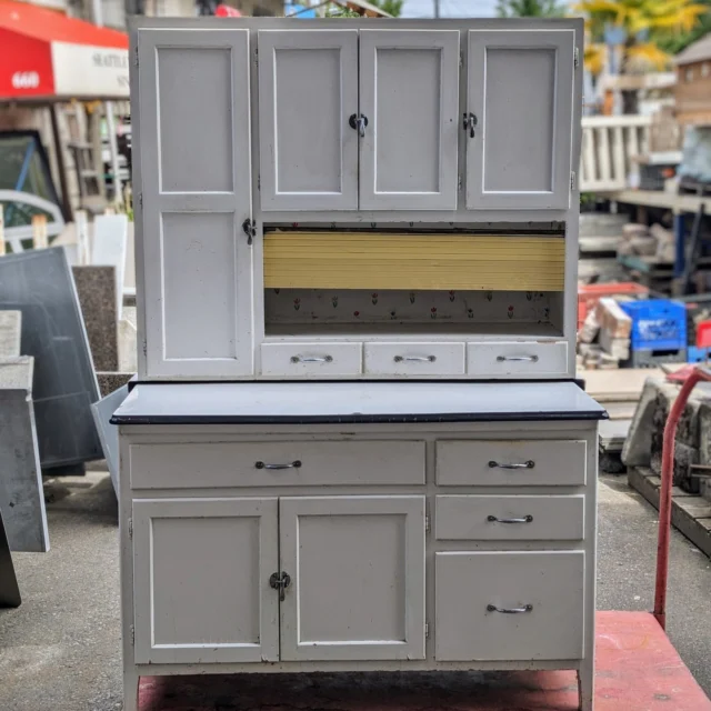 EDIT: Sold, thank you!Remember Sears? Remember those giant phone book catalogs they'd mail out before the internet existed? Are you old enough to remember when it was called Sears & Roebuck? Well, if so, then you probably know what a Hoosier cabinet is. For the rest of us, just know it's a space-saving cabinet unit with tons of of drawers and unique storage options for all kinds of items. And look at that shipping stamp on there! That massive building on Utah Street, where the big ol' mermaid coffee HQ is currently located in SODO, was originally a Sears distribution center where employees famously wore roller skates to get around the massive floor plans and hand off their work/packages to the designated spots and drop-off points. Anyways, that's enough forgotten retail history for one Friday. This antique Hoosier unit shows its age, but has rock-solid bones and hardware. Some sanding and some fresh paint would have this looking good as new, yet delightfully retro and nostalgic.Measures 49.5"W x 69.5"H x 25"DSeattleID: 95466$450You can place a 24 hour hold on this item by calling (206) 624-4510 and requesting a hold on item ID 95466#Antique #Sears #SearsRoebuck #HoosierCabinet #Hoosier #AntiqueCabient #SpaceSaver #Efficiency #SODO #SearsCatalog #Storage #Cabinet #HomeDecor #Furniture #Fixtures #Salvage #Seattle #Earthwise
