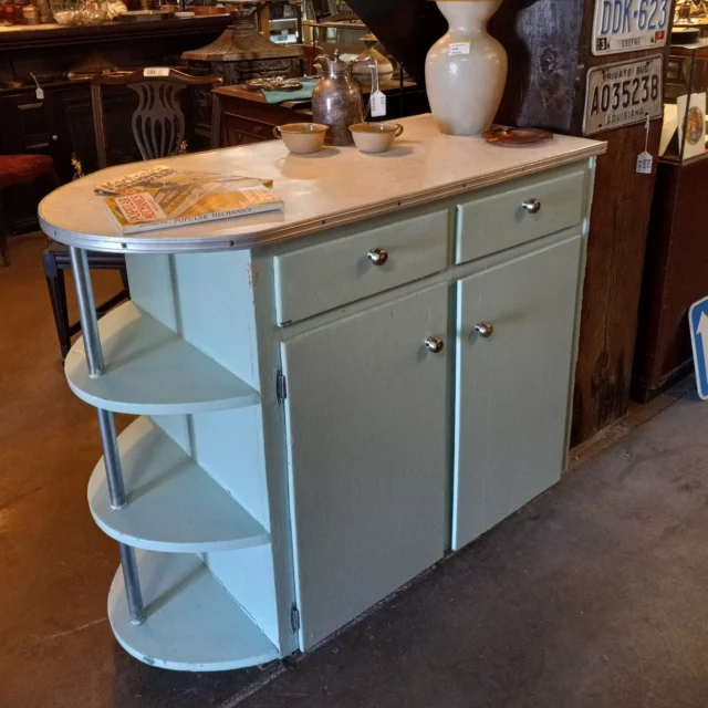 Well, look at this lil' cutie patootie! This adorable 1950's kitchen island/cabinet-mini bar is in good condition besides missing the toe kick plate trim. We offer free toe kick plate trim with a purchase of a lower cabinet of your choice in a few colors to choose from. Just ask a cashier or email Tacoma@ewsalvage.com for more details. The Formica top is in great shape except one tiny chip. The right side is unpainted where it was against a wall. It is plywood construction and comes with new hardware pulls. Drawers open properly and doors close well, but one sticks slightly. Get this glorious vintage piece for a great price today!Measures 41.5"W X 20.5"L X 36.25"HTacomaID: 96011$195You can place a 24 hour hold on this item by calling (253) 476-7837 and requesting a hold on item ID 96011#KitchenIsland #1950sKitchen #Retro #Vintage #VintageKitchen #KitchenCabinet #MiniBar #RetroKitchen #VintageKitchenIsland #Storage #Counterspace #Kitchen #Fixtures #50sKitchen #LeaveItToBeaver #Salvage #Tacoma #Earthwise