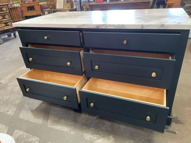 We've got a PRICE DROP in Kenmore for this modern and fabulous marble countertop buffet island! It's perfect for your kitchen refresh/update. What's one thing we all want more of in kitchens? Well, yes, cheaper groceries, sure. The other thing, though! That's right, MORE COUNTER SPACE. That's why you want a kitchen island, look at all that marble counter space. Lovely. The lower is made of wood and painted dark blue with gold drawer pulls. Six drawers on both(!) sides and they're all slow-closing. (/slaps countertop) You can fit so many accoutrements in this bad boy!Some trim came off in the move and there's a hole for what looks like an outlet. Overall in good condition and you can't beat this price, so act fast!Measures 74"W x 41.5"H x 38"DKenmoreID: 93839$1250 (was $1350)You can place a 24 hour hold on this item by calling (425) 481-0245 and requesting a hold on item ID 93839#KitchenIsland #Marble #MarbleCountertop #Buffet #BuffetIsland #Deals #Sale #Discounts #KitchenIslandIntheSun #YoullBeCookinAndHavinFun #KitchenReno #KitchenRedesign #DesignerKitchen #ModernKitchen #ContemporaryKitchen #Counterspace #Storage #InteriorDesign #Salvage #Earthwise #Kenmore